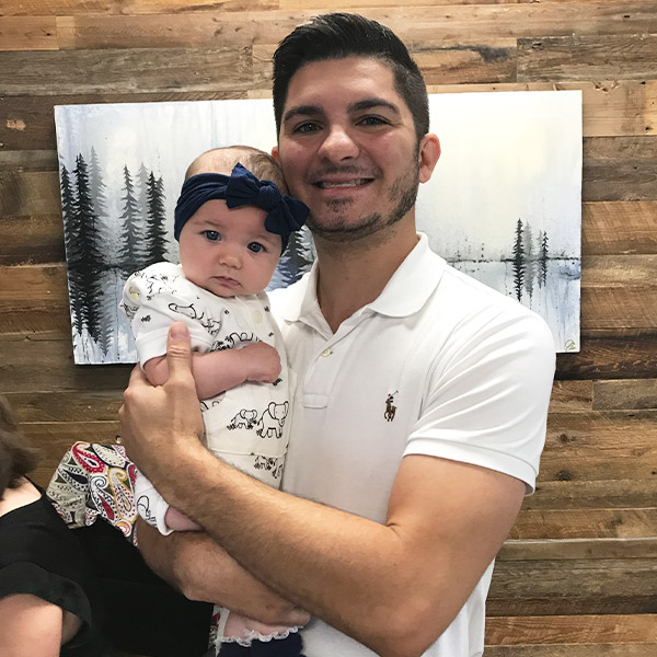 Chiropractor in Cochrane AB Troy Scottaline with Child Chiropractor in Cochrane AB Troy Scottaline with Child